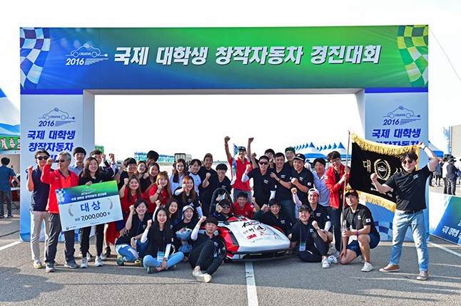 Picture: members of KUST (Kookmin University Solar Car Team) are celebrating the win by their electric vehicle made of SK chemicals’ prepreg SKYFLEX
